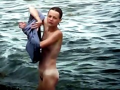Tanned nudist chick water and beach vids
