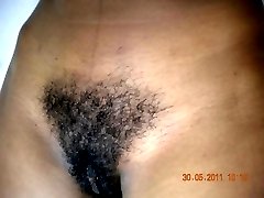 Black chick with hairy cunt posing naked