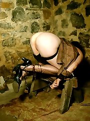 tattoo chick in heels chained in basement dungeon