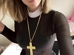 Pious girl with a cross demonstrates her tits and pussy