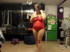 Fat chick does a undress tease