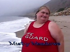 Enormous lifeguard bitches munch food on the beach