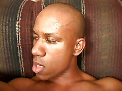 Ebony stunner gets hot cum after fucking a black dick on the sofa