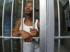 Horny police woman deep-throats the prisoner's dick in his cell