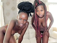 Two African women masturbating