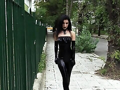 Ultra sexy goth girl dressed in black lipstick in public