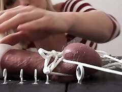 Unrighteous dominatrix plays with her sissy slave.s dong