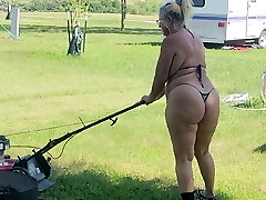 Got back to find wife mowing in a panty bikini, her ass and thighs wiggling with every step 