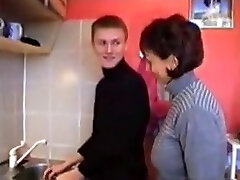 Russian mother Amalia with her boy in kitchen