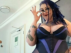 Bbw MiLF with big tits and tattoos gives pierced man-meat a hand job.