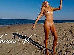 Naked Workout on the beach - a splendid skinny milf with small tits