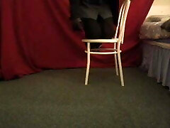 Playful motel maid wearing high heels