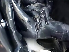 Nymph With Gigantic Boobs Encased In Black Rubber Latex Catsuit Enjoys Bucket Of Hot Cumm - Part 2