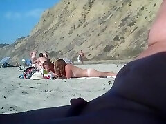 2 girls make fun with a guy's microdick on a naturist beach
