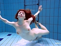 Ginger-haired Marketa In A White Dress In The Pool