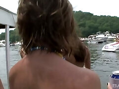 Glorious slim teens flaunting on a party on a boat sans bra