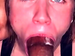 Blue-eyed submissive maintains eye contact while sucking Big Black Cock tip