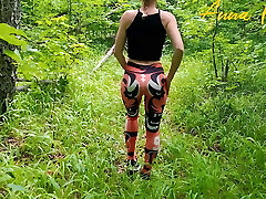 Public onanism, a girl in leggings walks in nature