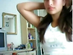 Cute brunette girl plays with her gigantic titties and shaved pussy on cam
