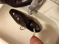 Piss in men's sundress shoe