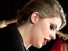 A caged slave gets strapon anal intercourse