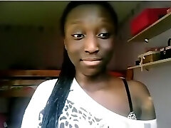 Black girl flashes her ass and good-sized tits on cam