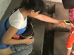 Chinese ladies in an old public toilet
