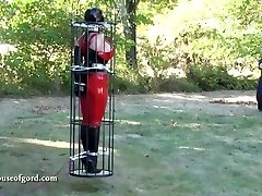 latex restrain bondage doll jewell caged and stored in silo