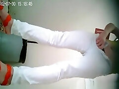 Asian lady in white pants pissing
