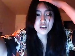 asian showing off her assets on webcam