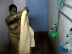 Gigantic Indian girl washes her body in the bathroom in hidden cam pinch