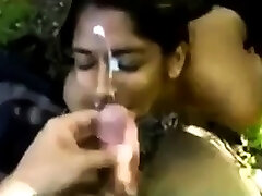 Indian girl taking an outdoor facial cumshot