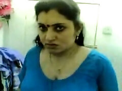 Cute and chubby Indian wifey teased on the bed in front of web cam