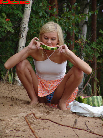 Blonde teen pissing in the beach