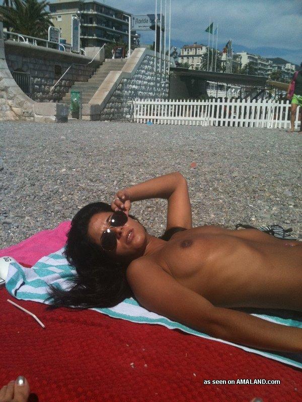 Topless girl latina sunbathing