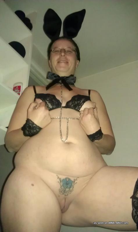 BBW in lingerie shows off her shaved cunt pic