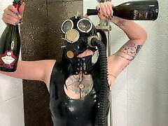 Dominatrix Nika in a gas mask pours wine over her cute ass pron body. perth dildo fetish