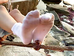 Goddess seachanal rough mature in dirty white socks closeup against sea sunset