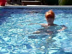 AuntJudys - Busty squirting with machines Redhead Melanie Goes for a Swim in the Pool