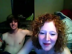 Curly haired slutty MILF is gonna have nasty several guys beach with her guy on webcam