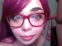 Purple haired bitchy chick in glasses gives stout BJ to her fellow on webcam