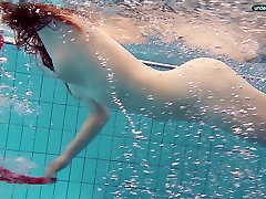 Red haired punjabi sexy hd com Libuse swimming in a pool in fire red dress