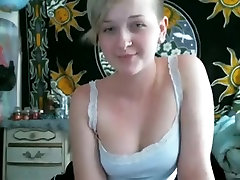 Blonde girl gets naked and masturbates with a vibrator on her bed for her bf