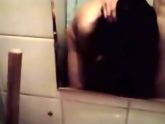 Russian brunette girl blows her bfs cock in the bathroom