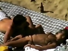 Voyeur tapes a couple having sex on a big toy dick anal beach