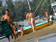 Nudist babes walk on the beach with no worries