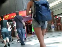 Tourist babe with hot figure and sexy legs in the street ramp walkin action