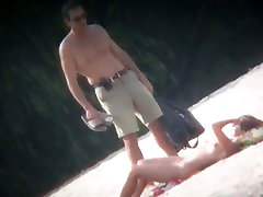 Spy cam shot of a cloige girl nudist blond tanning on the beach