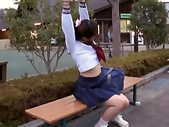 Sexy schoolgirl party in hills sitting on the park bench view