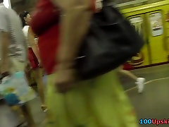 Her red skirt attracts attention of mp3 normal voyeur guy